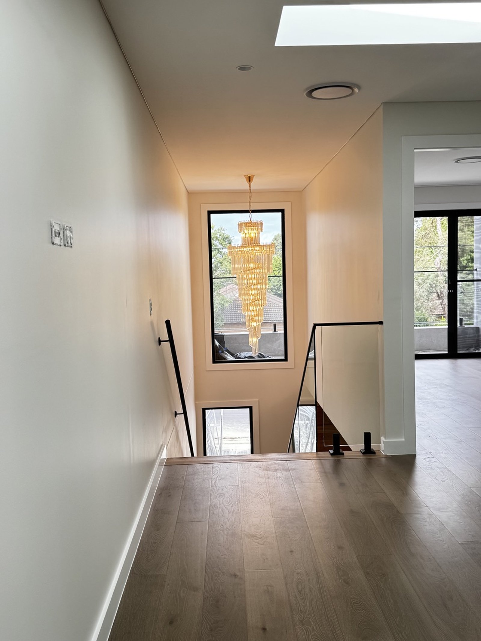 Guildford Duplex stair void and feature chandelier