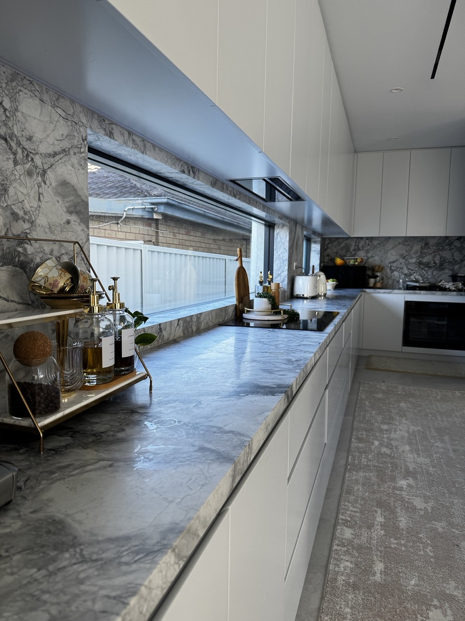 Lidcombe Residence stone kitchen and custom cabinetry